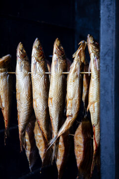 Fresh fish being smoked in the outdoor smoke house in Dziwnow in Poland
