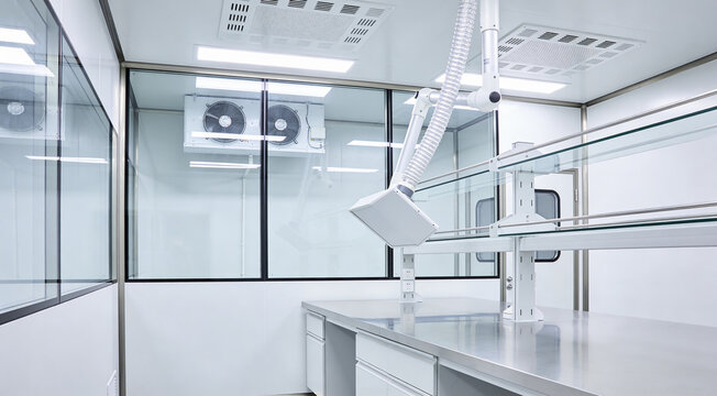 Modern laboratory cleanroom with stainless steel workbench and ventilation system