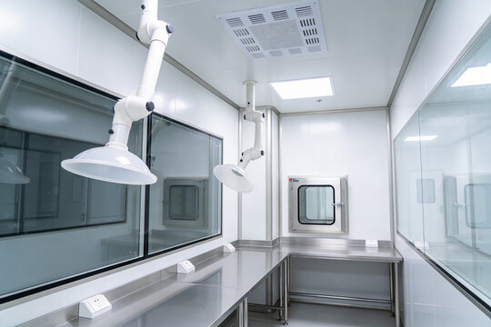 Modern cleanroom laboratory with stainless steel benches and fume hoods