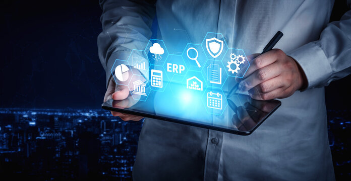 Business Professional Using Tablet to Manage Data with Futuristic Icons Representing Technology and Information in Urban Nightscape Fluxor.