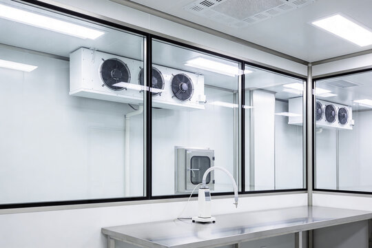 Modern laboratory cleanroom with cooling units and stainless steel workbench