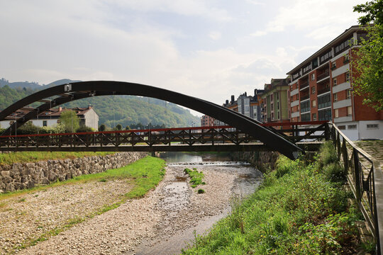 Bridge over The Guena river as it passes through Cangas de Onis, Asturias, Spain