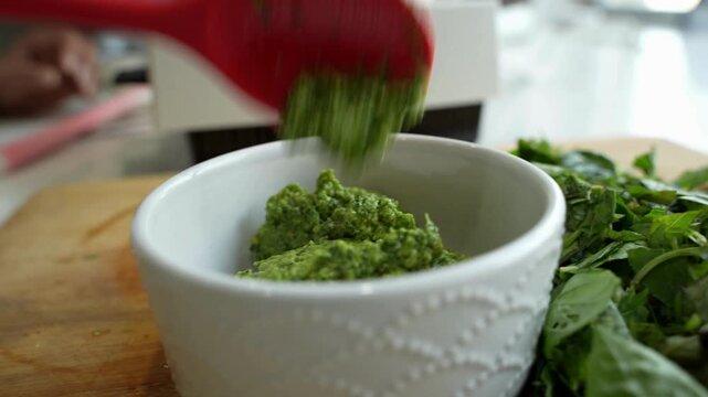 mint leaf transformed to mint paste using grinder in kitchen.