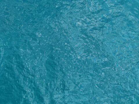 Top down aerial view of crystal clear turquoise tropical sea water texture in Puerto Princesa, Palawan, Philippines