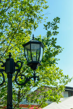 Lamp street in outdoor restaurant,Pendant light with matal lamps in street cafe,mountain view and sky,Simple home outdoor interior..