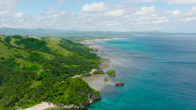 Drone view of white sand and transparent sea water with corals. Santa Fe, Tablas, Romblon. Philippines.