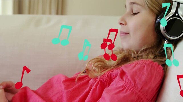 Girl reclining with headphones tapping phone, picking music to relax on sofa while notes floating