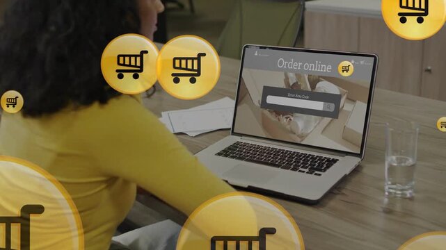 Woman viewing Order online on laptop, starting gold cart icons overlaying drifting promoting retail