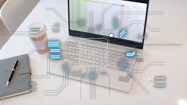 Open silver laptop showing sheet on frame two HUD appearing circuit pulsing mapping data flow