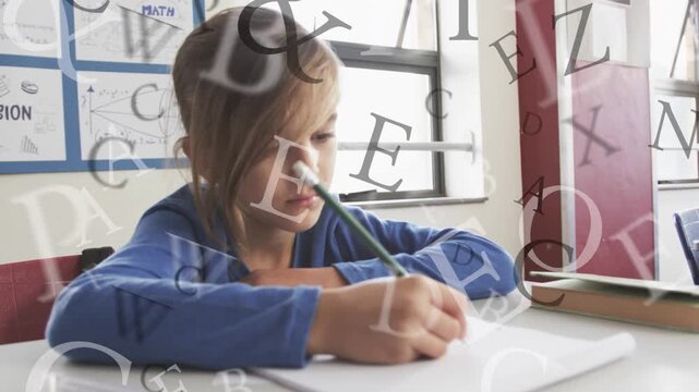 Boy student bringing pencil to paper, doing math while faint letters drifting over hand and paper