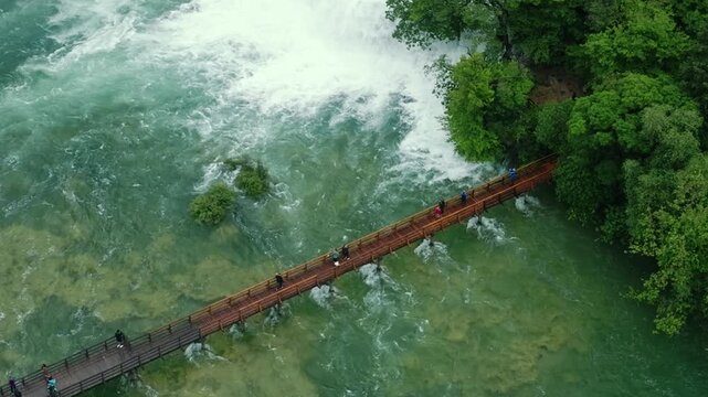 Cinematic footage of Plitvice Lakes National Park in Croatia featuring turquoise lakes, cascading waterfalls, wooden pathways, and lush forest landscapes