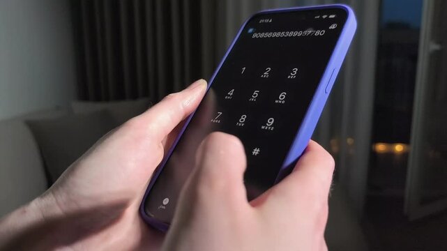 Hand dials a phone number on a smartphone in close up. The keypad changes to an active call screen during the clip. Mobile calling, contact, and communication concept for app and telecom use