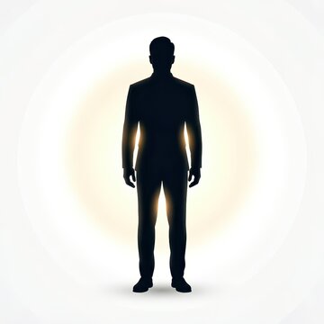 Silhouette of Man in Suit Standing Against Glowing Circular Background