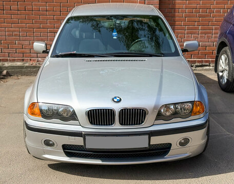 BMW 3 series e 46 in a parking lot. Motor car BMW E46 3-series 325 parked on street. Exterior of a fourth generation of the BMW 3 Series (E46) silver color. 