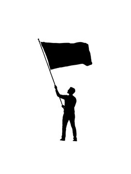 Silhouette of a man holding a waving flag