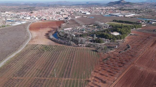 Drone aerial view of cultivated terrain, camping grounds and surrounding countryside near Bullas.