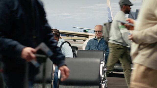 Chatting, runway control tower and multiethnic group of friends in airport transport hub. Travelling together, flight and multiracial people walking in departure terminal, talking, camera A