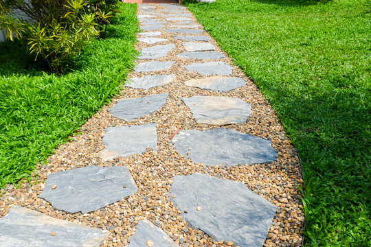 Garden landscape design with pathway in garden and footpath in picturesque summer park and staircase in backyard,Paving stones on floor in park,space for text.