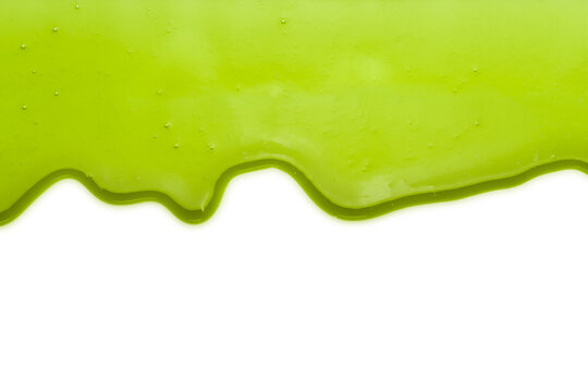 Green liquid transparent gel dripping down against white background.