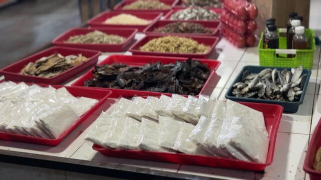 Vibrant array of diverse local provisions and culinary staples at a bustling community marketplace