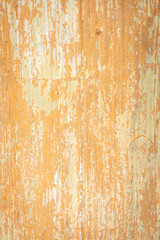 Fototapeta premium Weathered orange paint texture with peeling wooden surface and rustic abstract pattern for vintage background design.
