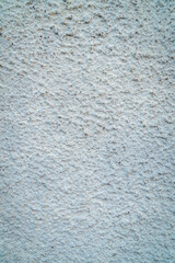 Fototapeta premium White rough wall texture background with granular plaster surface and abstract pattern detail. Minimal rustic backdrop for construction, interior design, wallpaper, and material concepts.