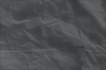 Fototapeta premium Crinkled gray fabric on a surface with many wrinkles and folds
