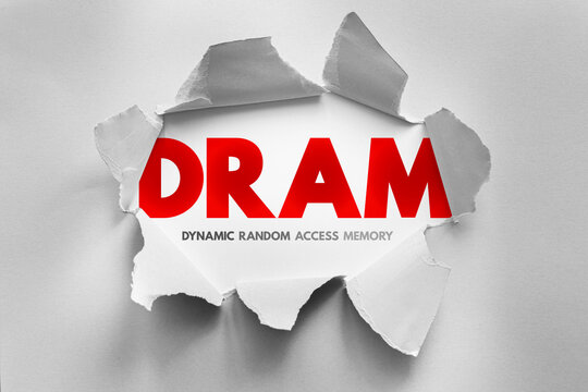 DRAM text revealed through torn paper surface, illustrating a computer hardware concept related to memory usage, system speed and processing support