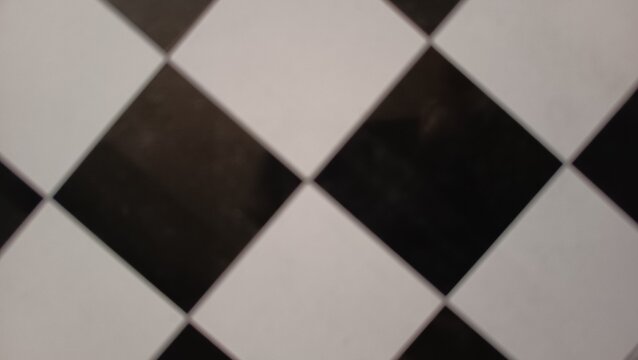 blurred abstract black and white diamond checker pattern