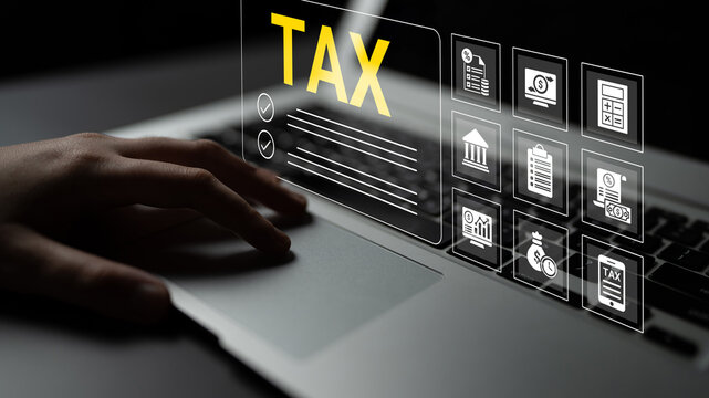 Close-up view of a hand typing on a laptop with digital tax-related icons surrounding it. Perfect representation of online tax preparation and filing processes in modern finance. Cyphers