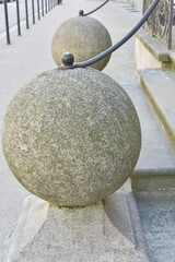 Close-up of a decorative ball architectural element with a metal details on an ourdoor terrace. © Яна Руднева