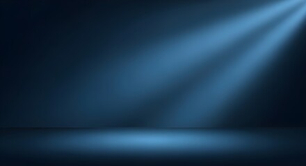 Obraz premium Spotlight beam on dark blue studio background, stage lighting, abstract light effect, dramatic spotlight, atmospheric lighting, performance stage