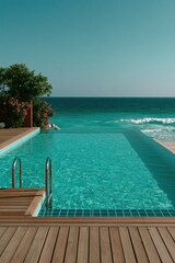 Obraz premium Vertical turquoise infinity pool with wooden deck and ocean view for summer wallpaper and resort banner design