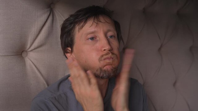 Man slapping his cheeks with both palms, high quality uncompressed audio recording. Sharp rhythmic hand sounds and expressive gesture. Emotion, tension and everyday human behavior concept.