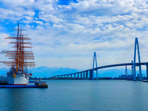 Kaiwo Maru Sailing Ship and Shinminato Ohashi Cable-Stayed Bridge with Tateyama Mountain Range, Imizu, Toyama, Japan