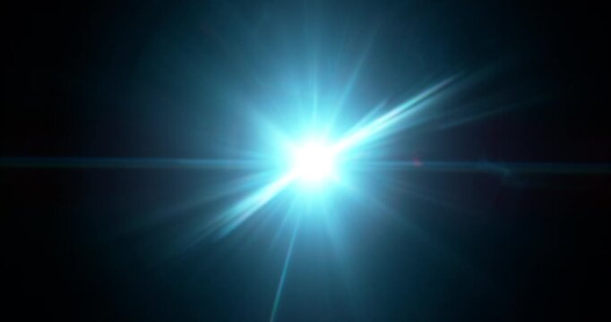 Slow motion of lens flare isolated on black background. Anamorphic lens. Cinematic glowing light overlay with optical streaks and rays for VFX compositing and transitions.