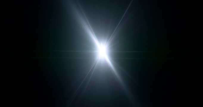 Slow motion of lens flare isolated on black background. Anamorphic lens. Cinematic glowing light overlay with optical streaks and rays for VFX compositing and transitions.