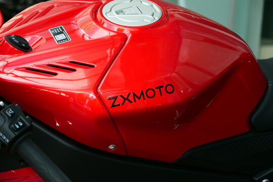 Qingdao,China-May.22.2026:A row of vibrant red ZXMOTO 820RR sportbikes with aerodynamic winglets is lined up inside a dealership showroom.