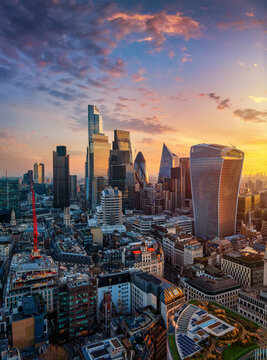 Aerial view of the City of London skyline, financial hub of the United Kingdom, during a golden sunrise