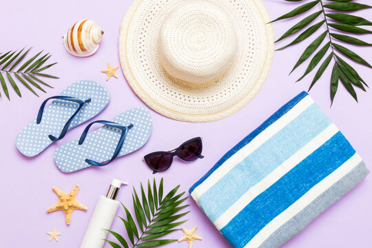Top view travel or vacation concept. Composition with stylish beach accessories on colored background, top view. Beach fashion flat lay, summer concept. Trendy colors