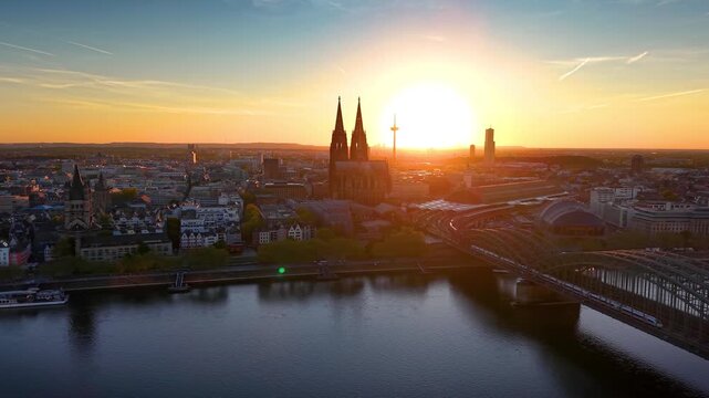 Panoramic aerial view of the skyline of Cologne, Germany, with River Rhine and Dome during a beautiful summer sunset