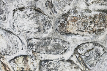 Fototapeta premium Rustic Stone Wall Texture Background for Architectural Design and Interior Decor, Weathered Masonry Surface with Natural Grey Rock Pattern for Flexible Layout Websites