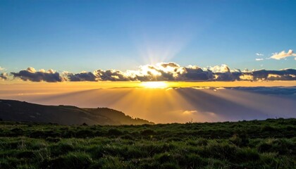 Obraz premium Sunrise Over Mountainous Landscape With Dramatic Cloud Formations.