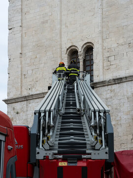 A fire crew removes dirt from the Church of Saint Nicholas in Bari.