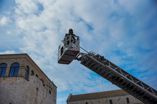 A fire crew removes dirt from the Church of Saint Nicholas in Bari.