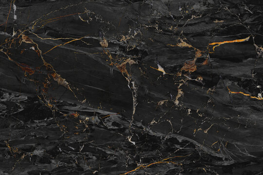 Abstract dark marble with golden veins. This luxurious stone features a dramatic black background intricately veined with shimmering gold, creating a sophisticated and elegant pattern