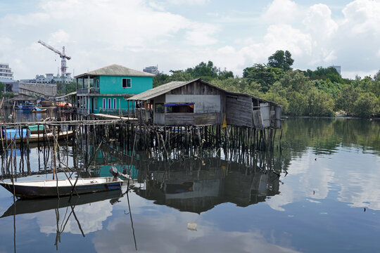 stilt house over calm water in batam
