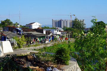 Fototapeta premium Urban canal flowing through a residential neighborhood