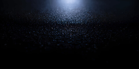 A dark blue background with rain drops on the window creates a magic winter night texture with a glowing star pattern © MDNUR