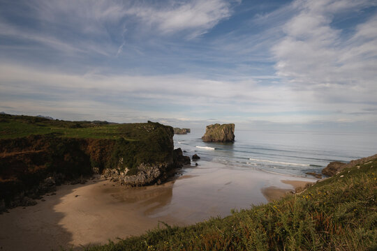 Wild inlet El Portiello beach and San Martin island  in Llanes, Costa Verde, Eastern Coast of Asturias, Spain